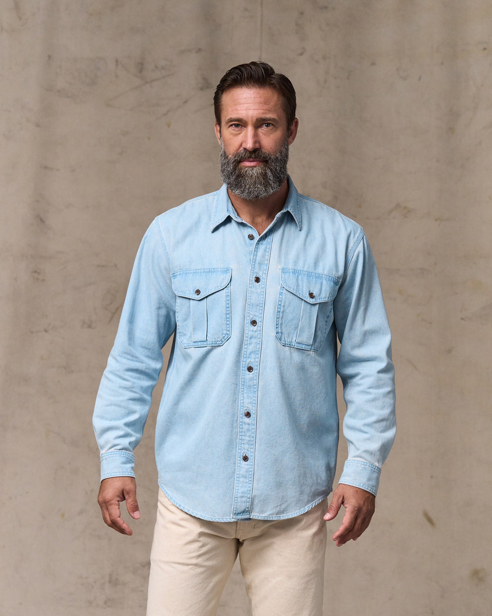 image of a model wearing Filson's Denim Guide Shirt - Light Indigo