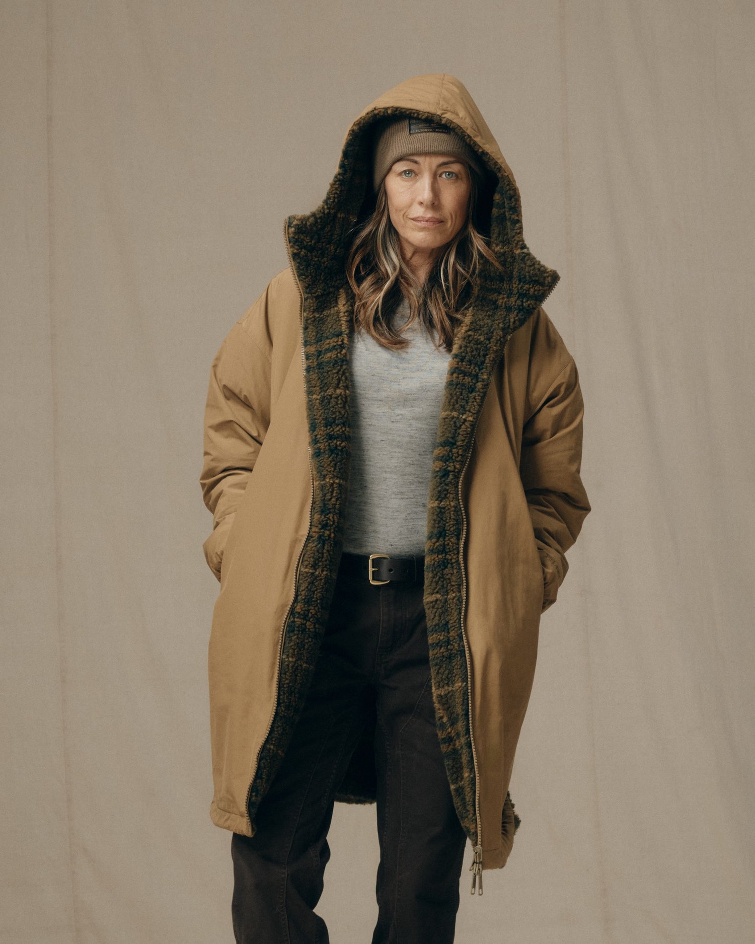 image of a model wearing Filson's Women's Reversible Woolly Fleece Coat - Tan|Model is 5'8" wearing a size medium