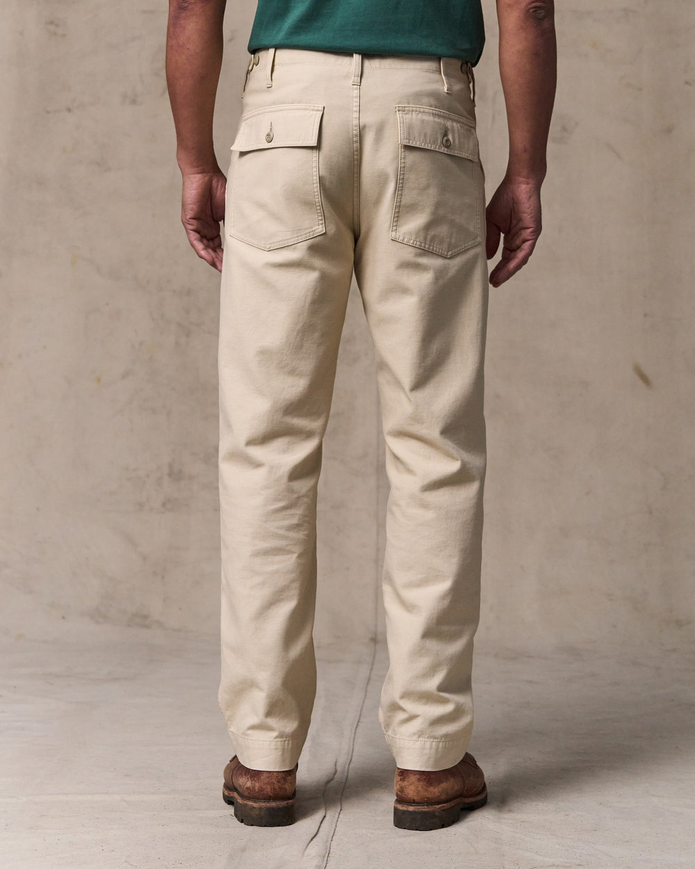 image of a model wearing Filson's Field Supply Pants - Washed Oatmeal