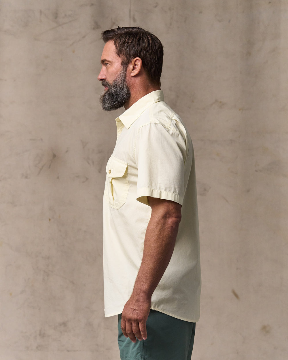 image of a model wearing Filson's Filson's Washed Short Sleeve Feather Cloth Shirt - Ivory
