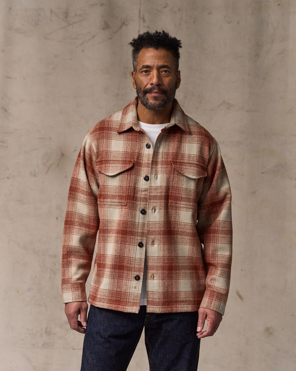 image of a model wearing Filson's Wool Jac-shirt - Brick Multi Plaid