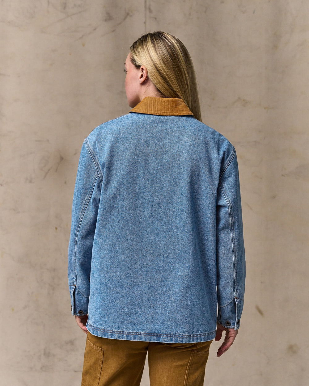 image of a model wearing Filson's Women's 11-oz. Denim Barn Coat - Light Indigo