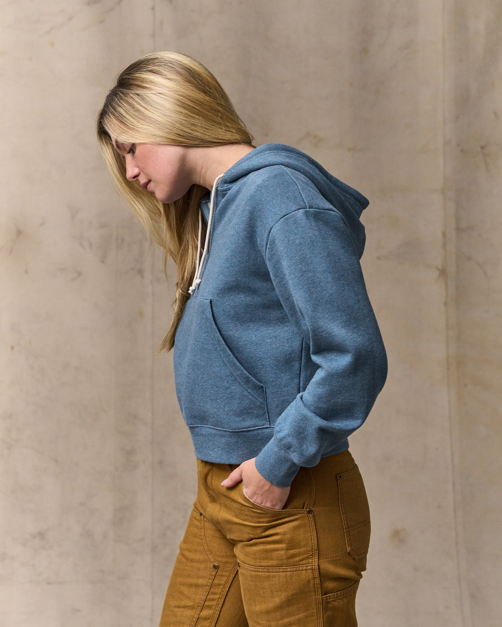 image of a model wearing Filson's Women's French Terry Half-zip Hoodie - Light Blue