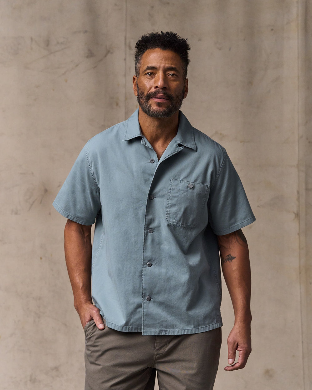 image of a model wearing Filson's Short Sleeve 4.5-oz. Twill Shirt - Lead