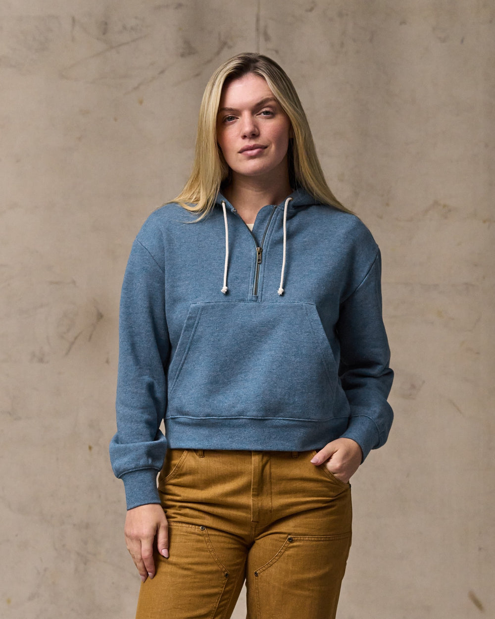 image of a model wearing Filson's Women's French Terry Half-zip Hoodie - Light Blue