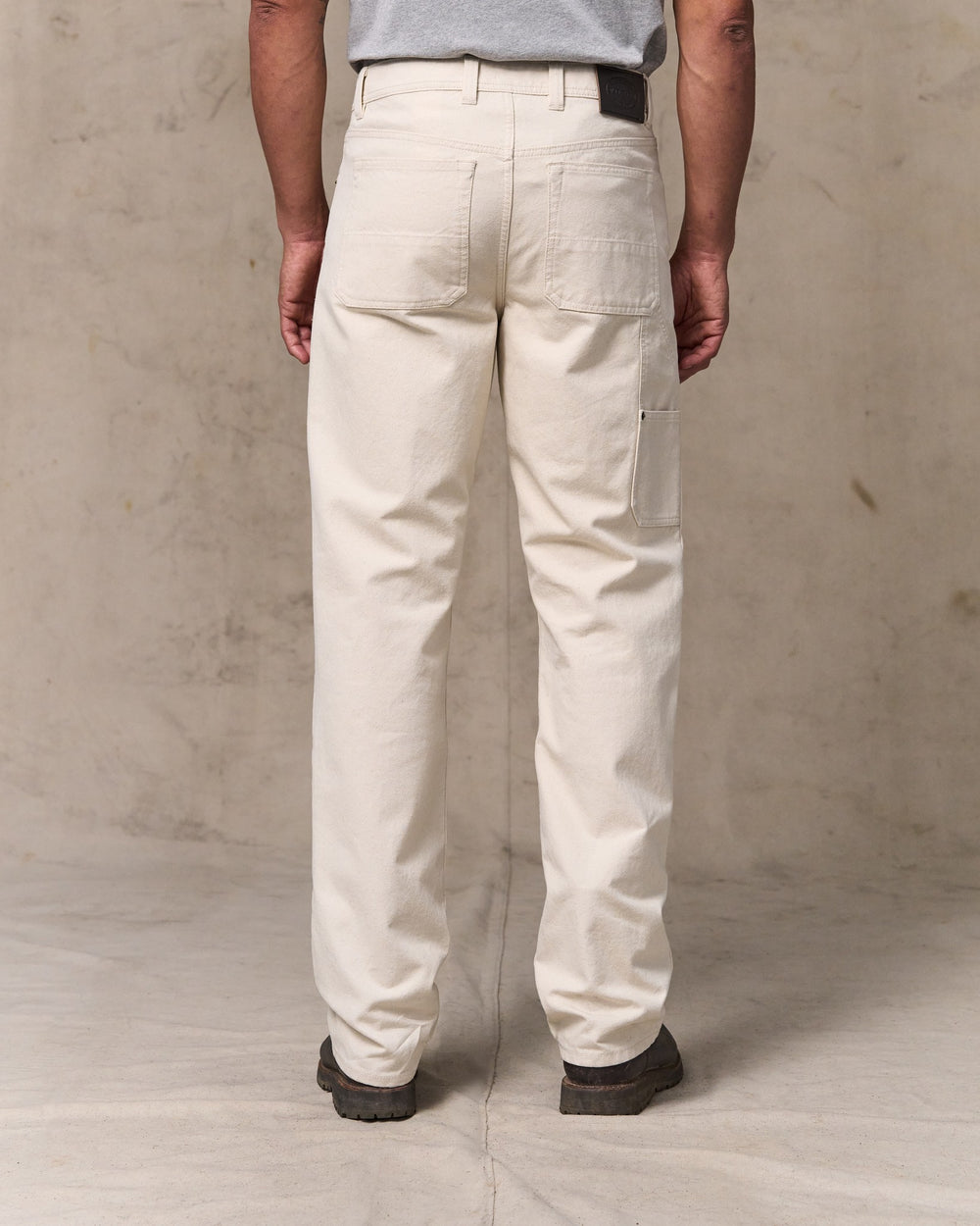 image of a model wearing Filson's Dry Tin Double Front Pants - Natural Seed