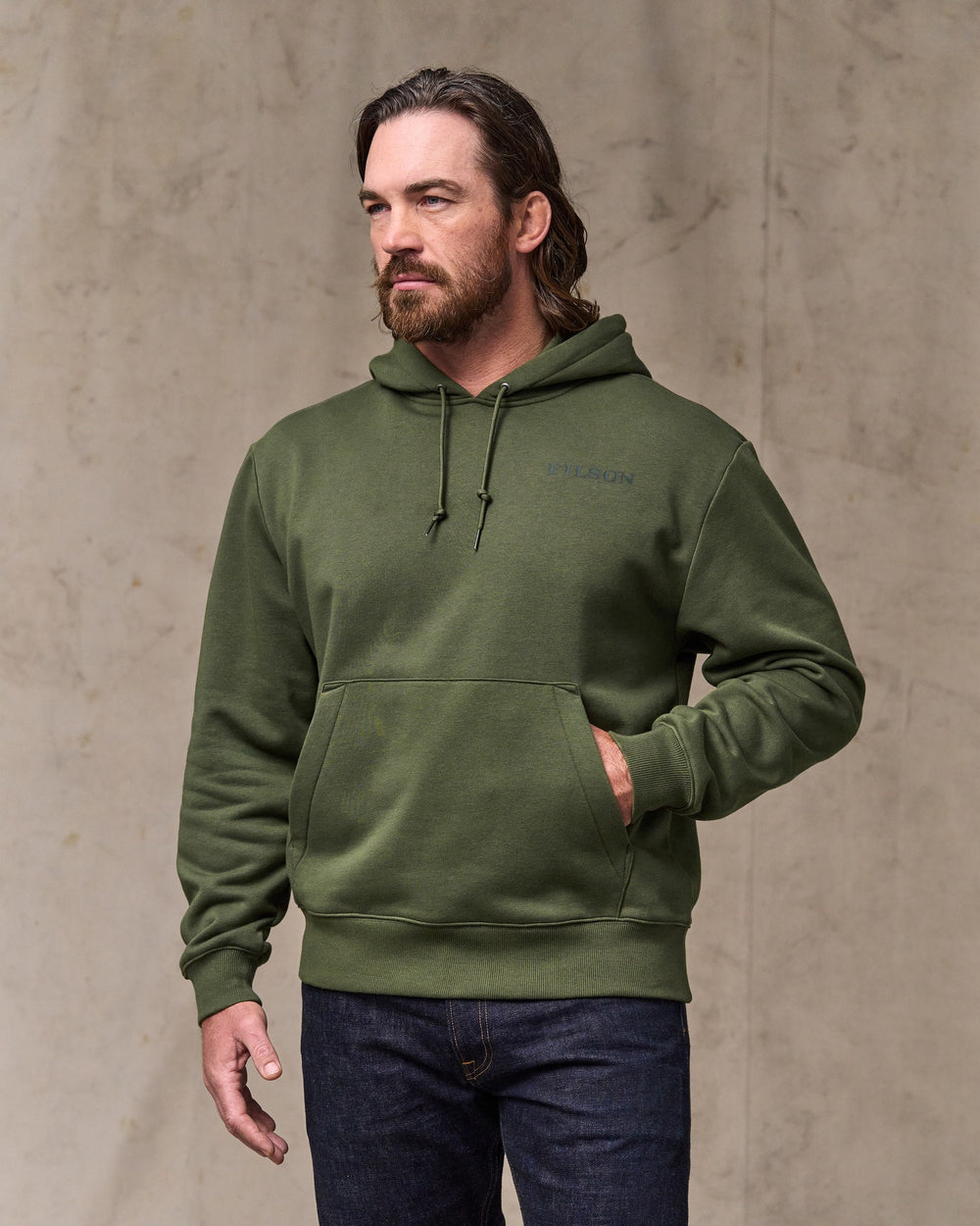 image of a model wearing Filson's Scenic Graphic Hoodie - Surplus Green