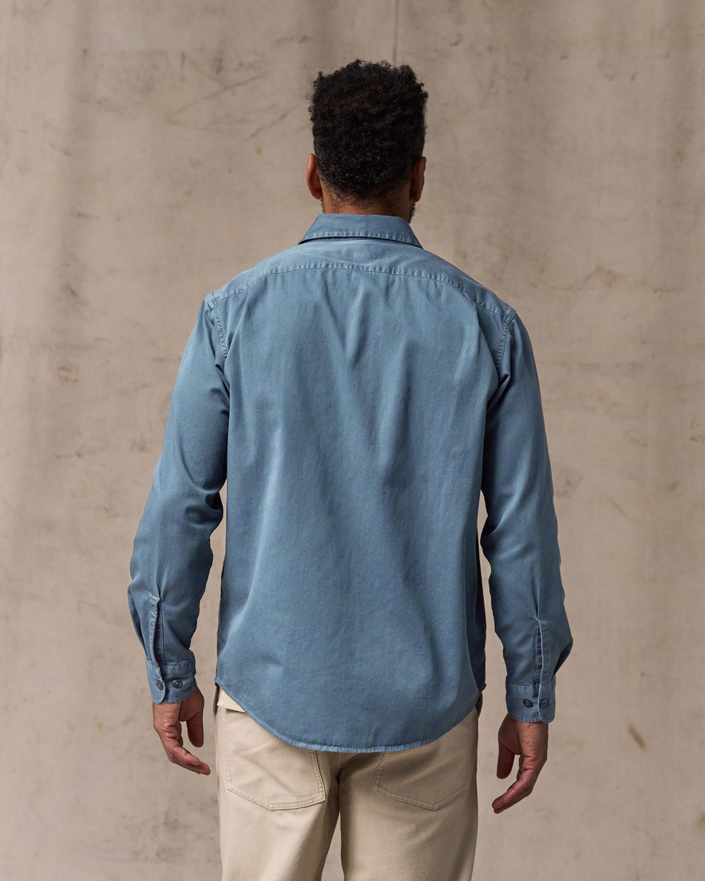 image of a model wearing Filson's 4.5-oz. Twill Shirt - Orion Blue