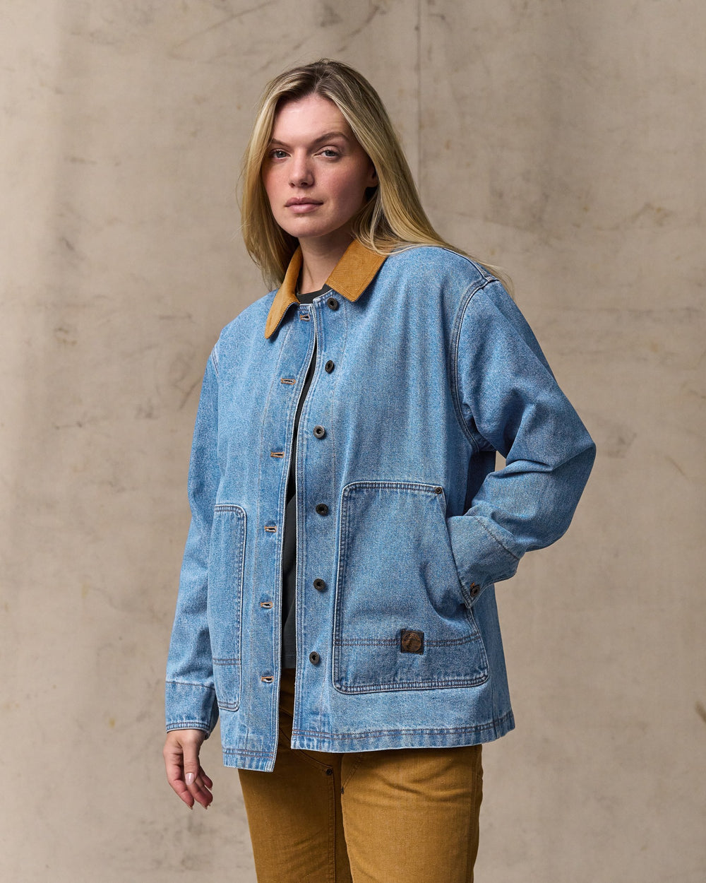 image of a model wearing Filson's Women's 11-oz. Denim Barn Coat - Light Indigo