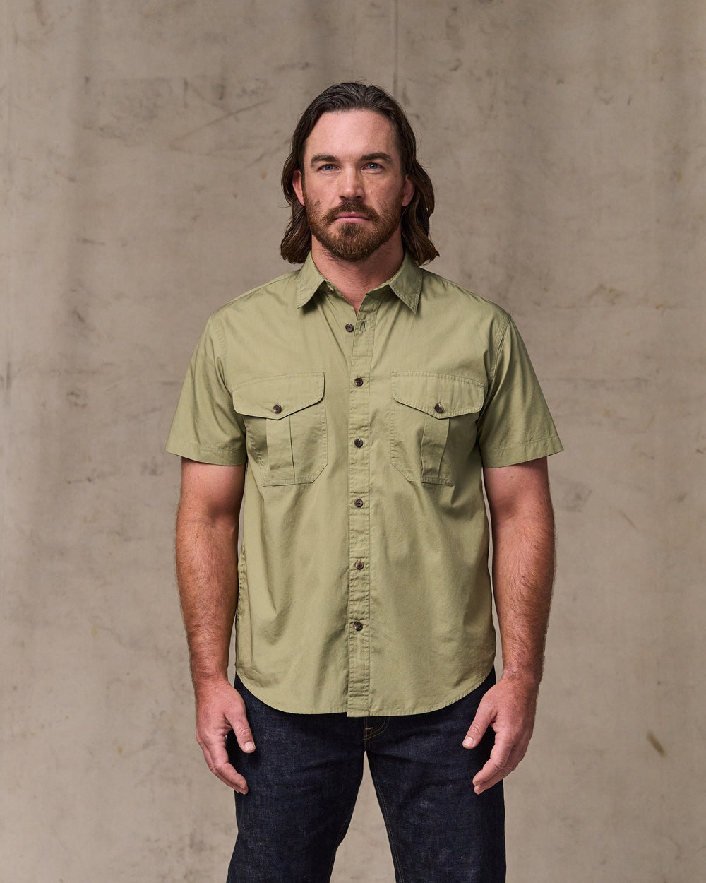 image of a model wearing Filson's Filson's Washed Short Sleeve Feather Cloth Shirt - Lakebed