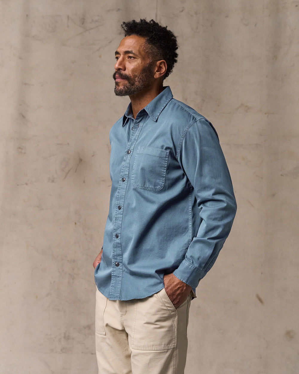 image of a model wearing Filson's 4.5-oz. Twill Shirt - Orion Blue