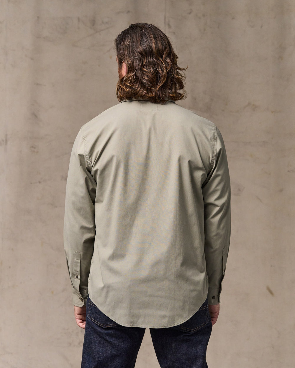 image of a model wearing Filson's Twin Lakes Sport Shirt - Dark Clay