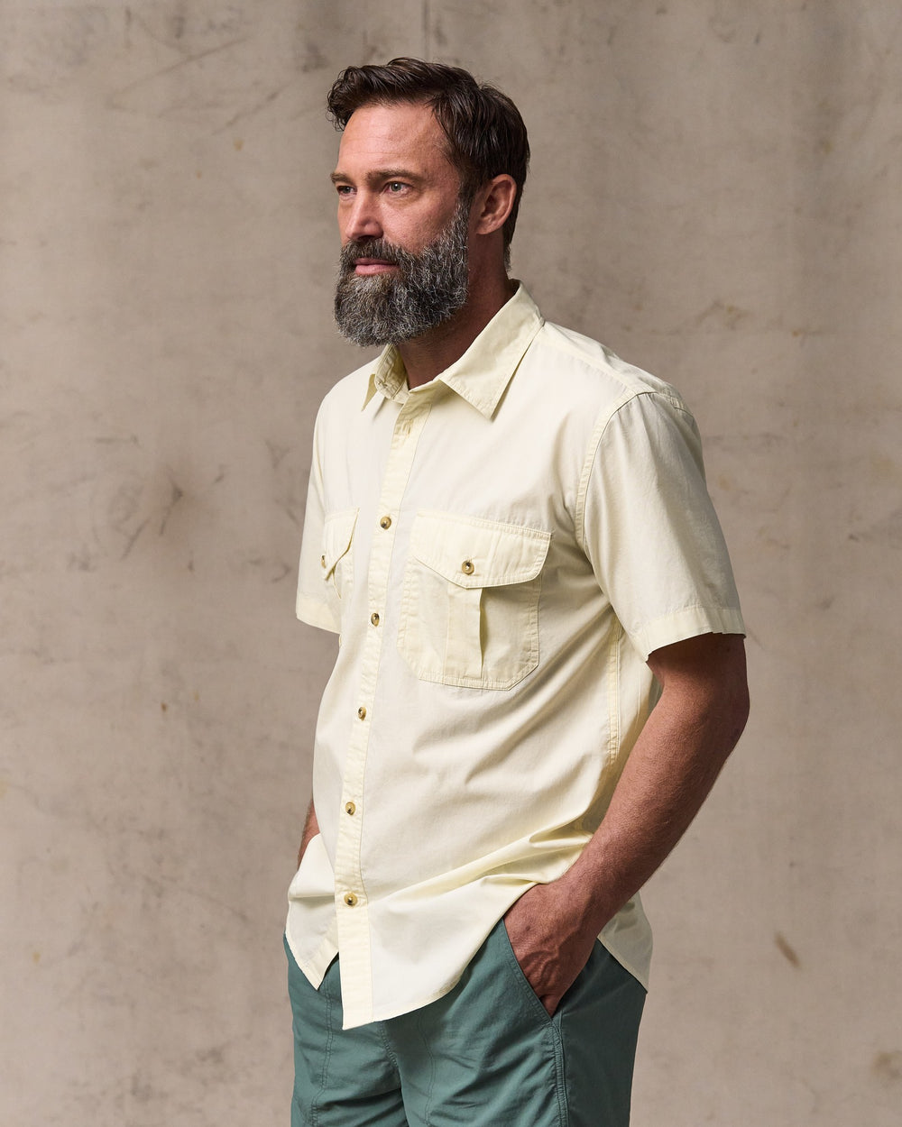 image of a model wearing Filson's Filson's Washed Short Sleeve Feather Cloth Shirt - Ivory