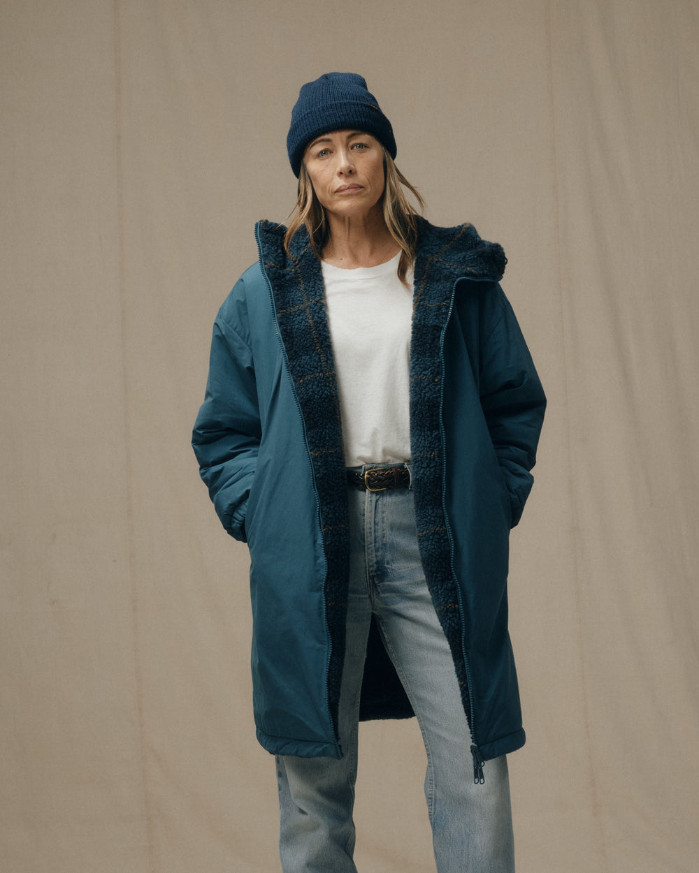 image of a model wearing Filson's Women's Reversible Woolly Fleece Coat - Dark Teal