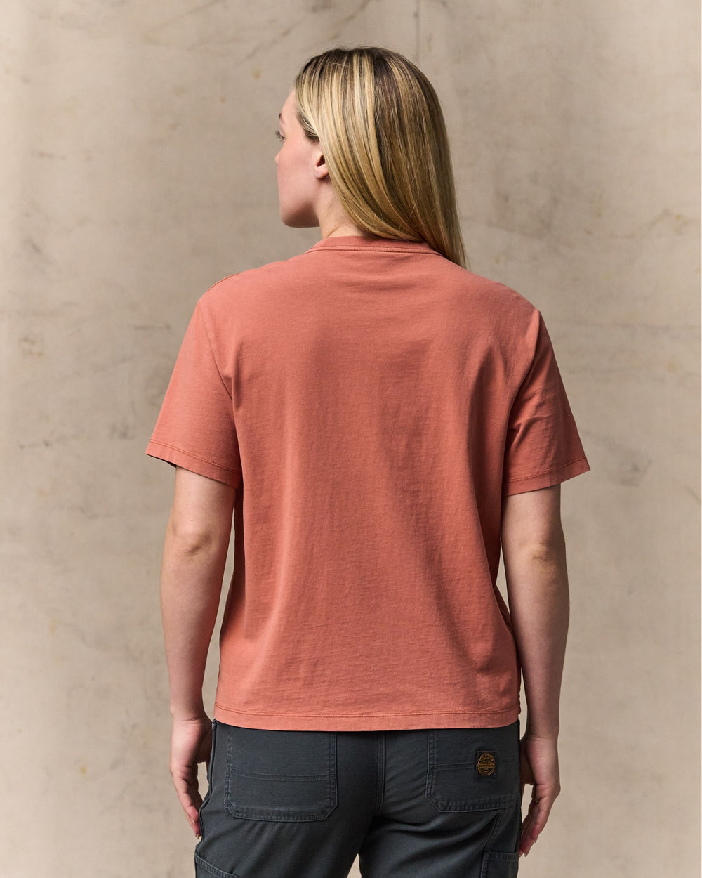 image of a model wearing Filson's Women's Short Sleeve Pocket Tee - Copper Brown
