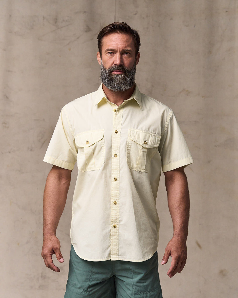 image of a model wearing Filson's Filson's Washed Short Sleeve Feather Cloth Shirt - Ivory