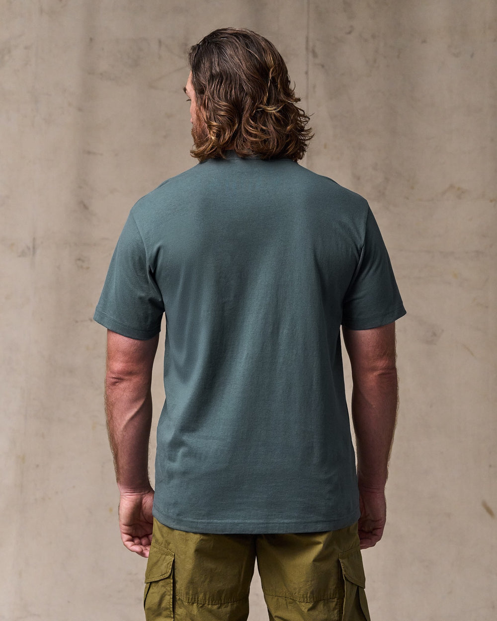 image of a model wearing Filson's Outfitter Pocket T-shirt - Dark Slate
