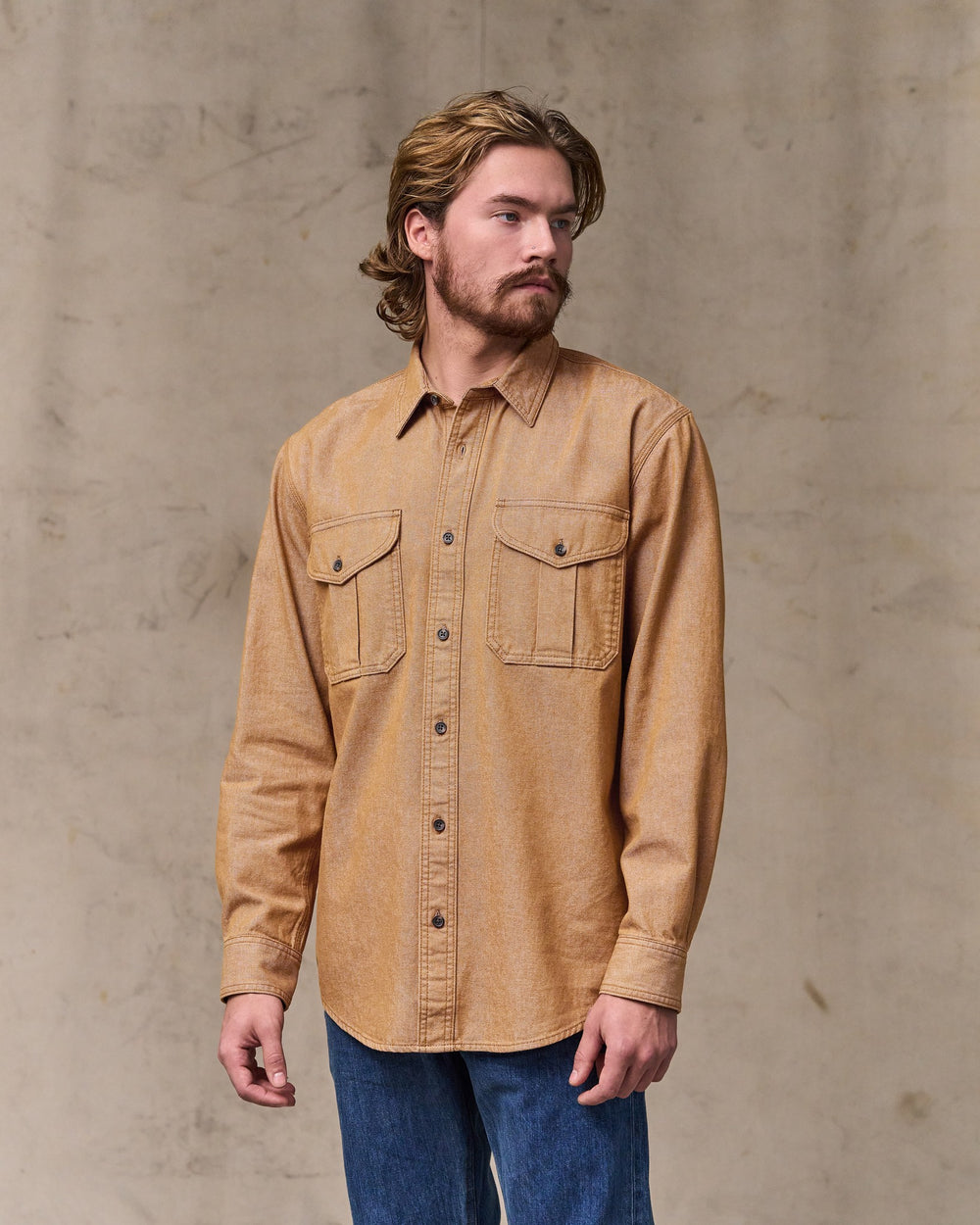 image of a model wearing Filson's Denim Guide Shirt - Harvest Tan