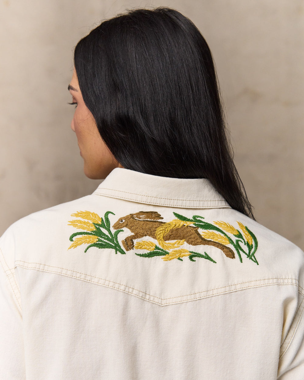 image of a model wearing Filson's Women's Embroidered Western Shirt - Natural Seed