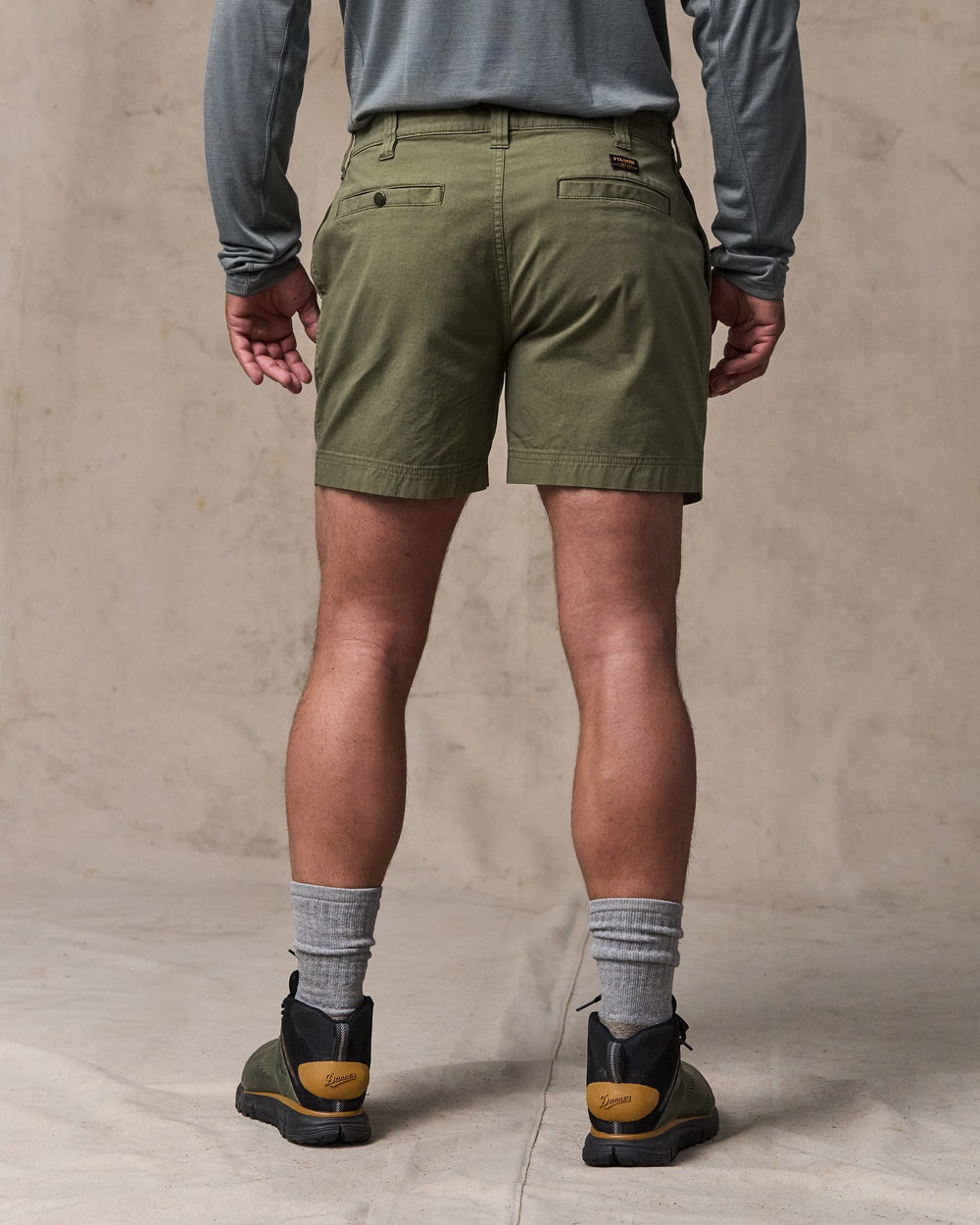 image of a model wearing Filson's Granite Mountain 6" Shorts - Burnt Olive