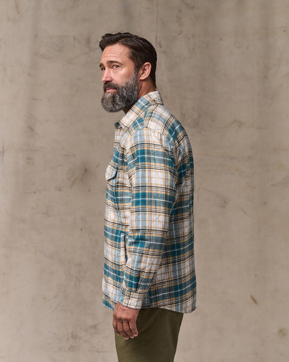 image of a model wearing Filson's Insulated Flannel Jac-shirt - Teal / Khaki Plaid
