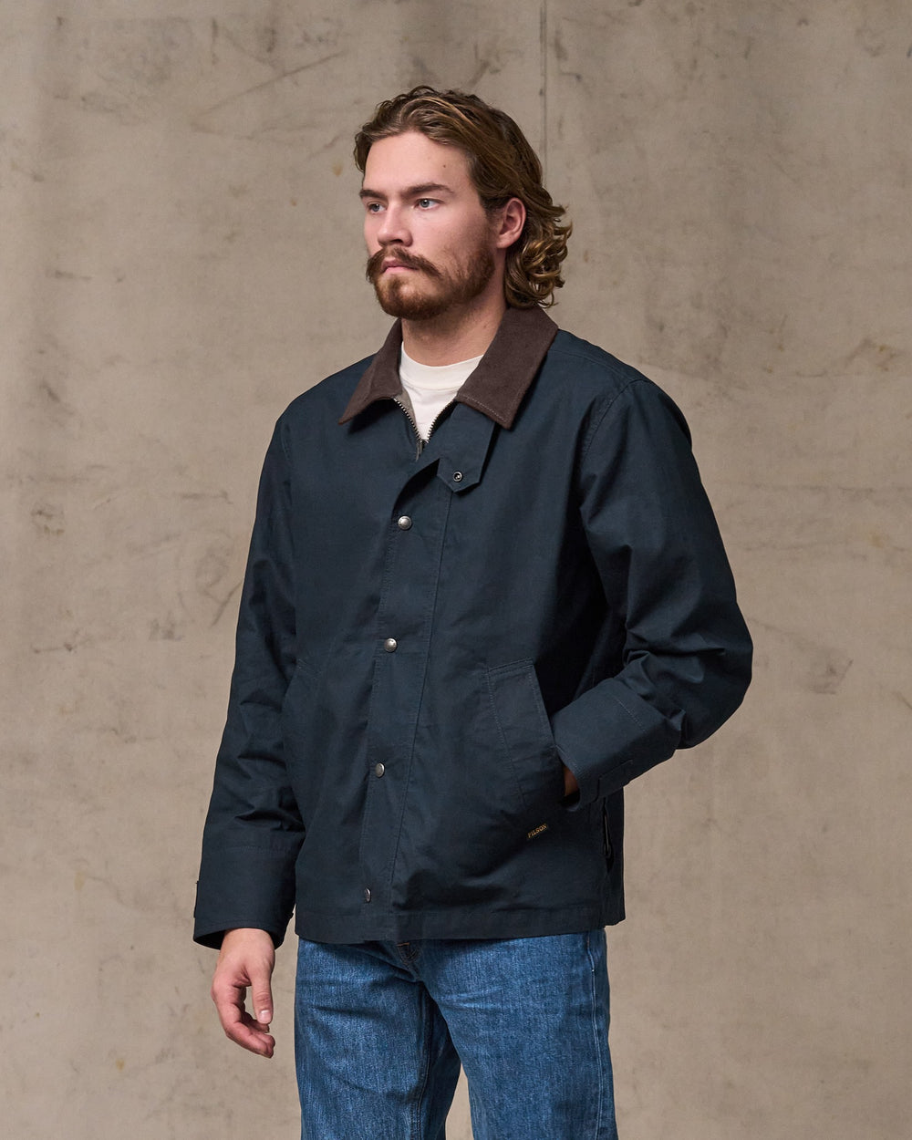 image of a model wearing Filson's Dry Wax Short Field Jacket - Navy