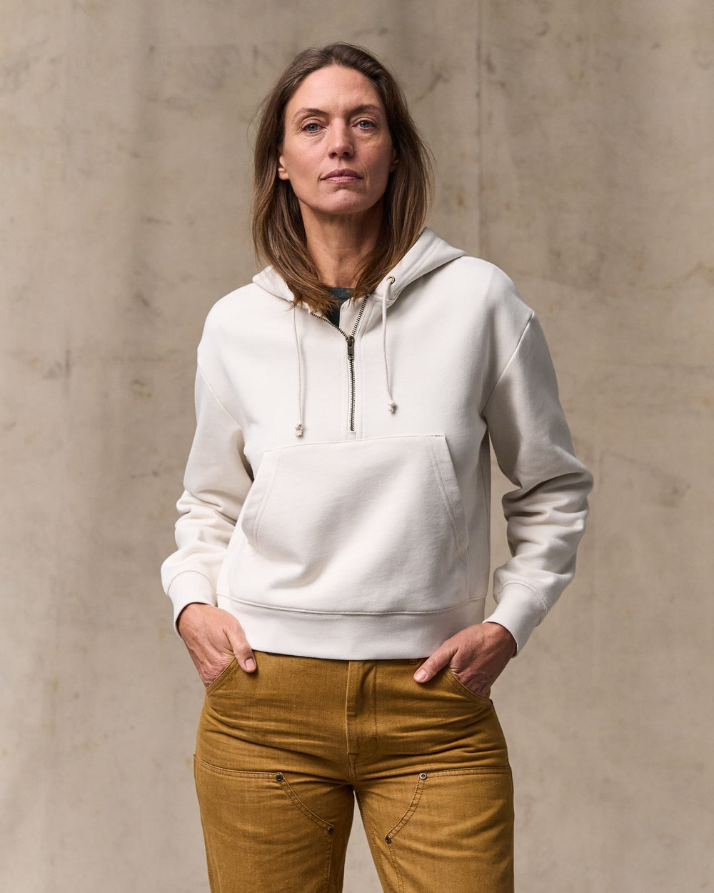image of a model wearing Filson's Women's French Terry Half-zip Hoodie - Ivory