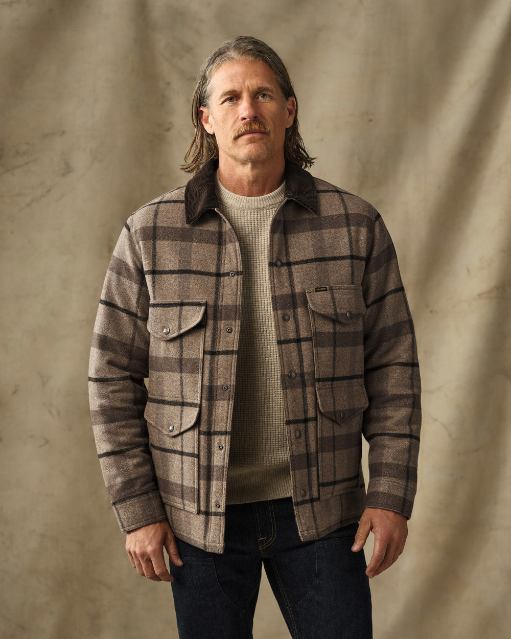 image of a model wearing Filson's Spokane Insulated Cruiser Jacket - Brown Heather Plaid