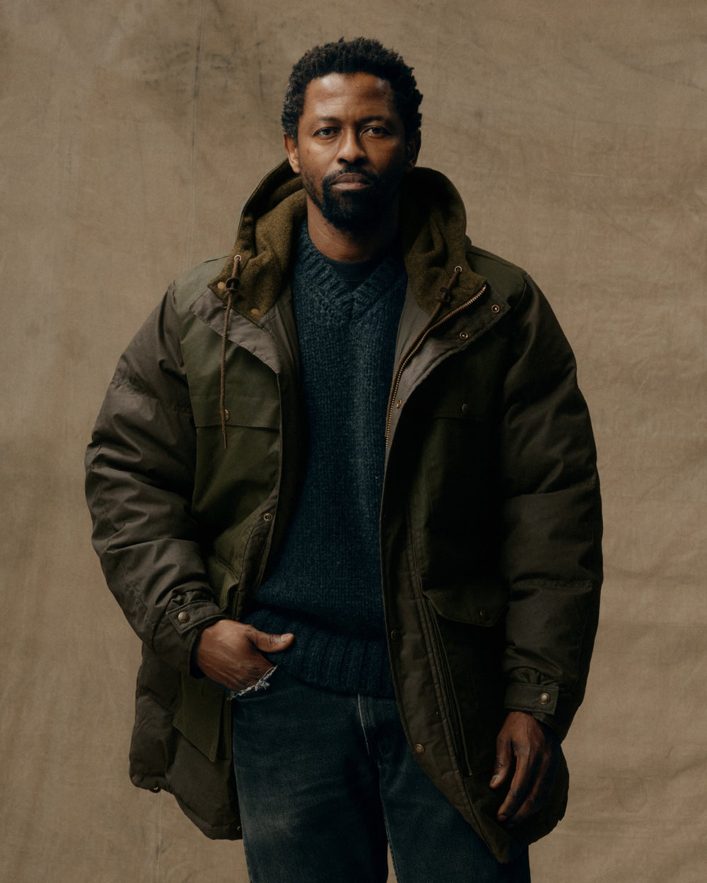 image of a model wearing Filson's Down Cruiser Parka - Otter Green