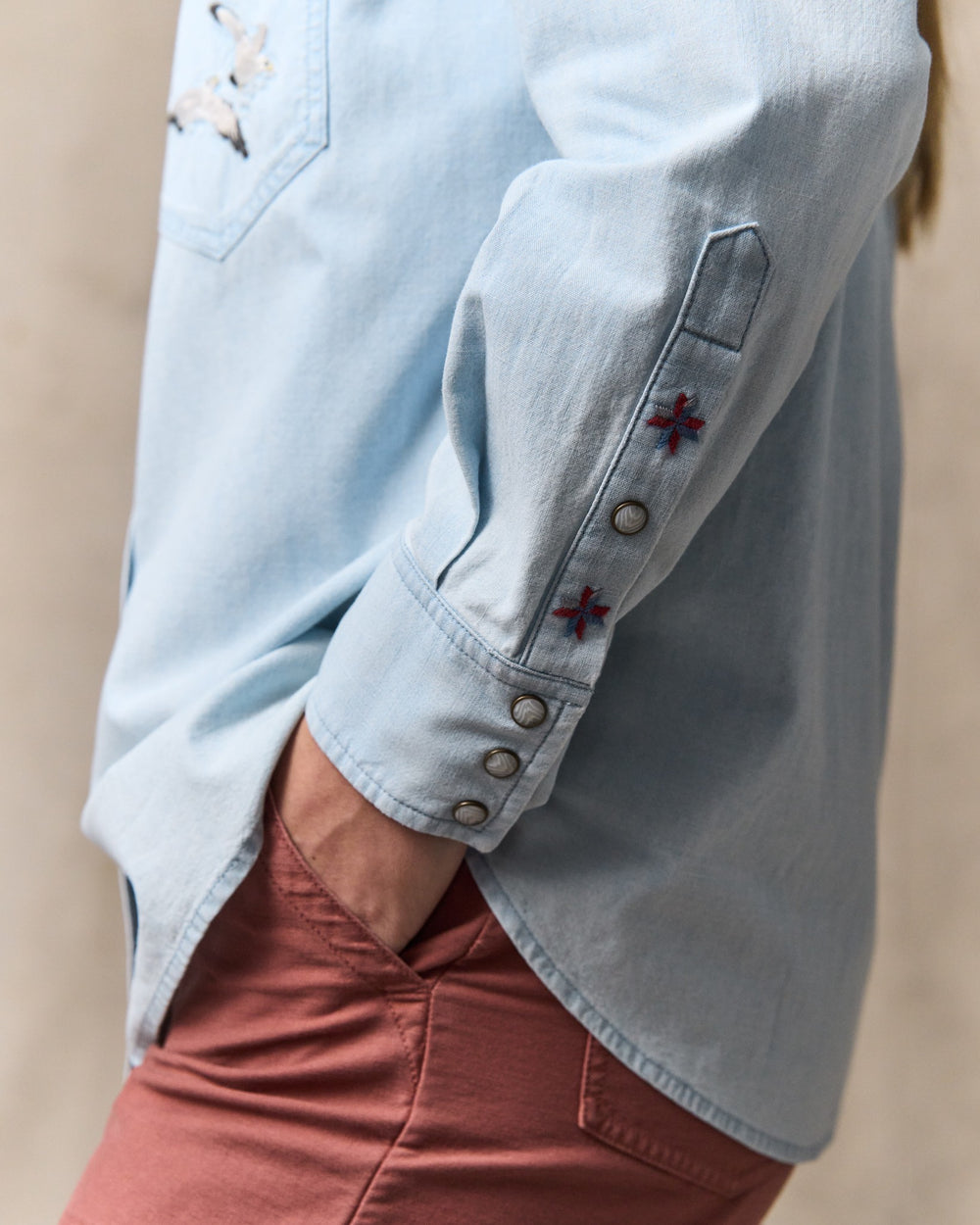 image of a model wearing Filson's Women's Embroidered Western Shirt - Light Indigo
