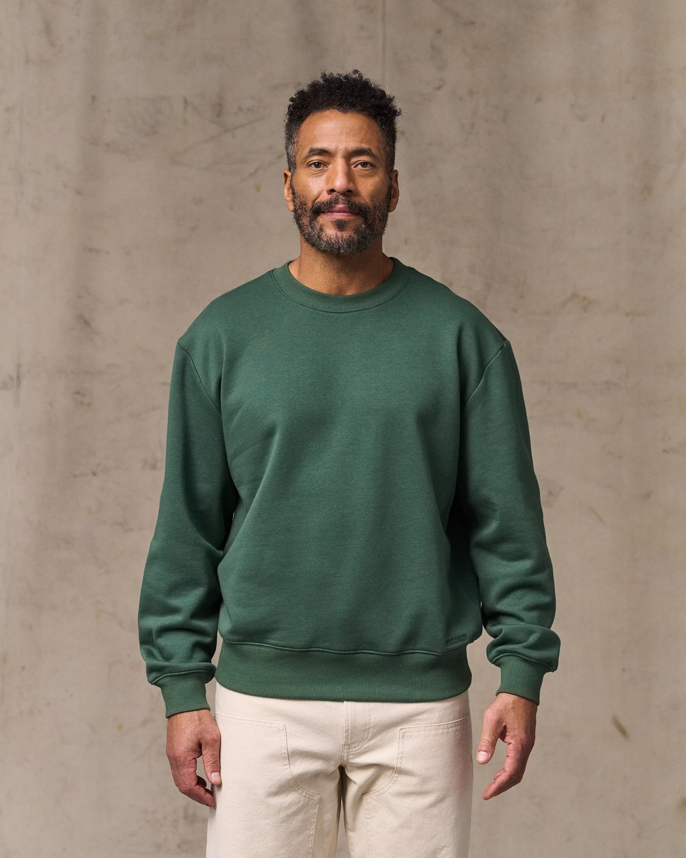 image of a model wearing Filson's Northwest Crewneck Sweatshirt - Granite Green