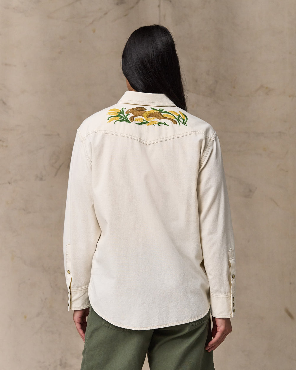 image of a model wearing Filson's Women's Embroidered Western Shirt - Natural Seed