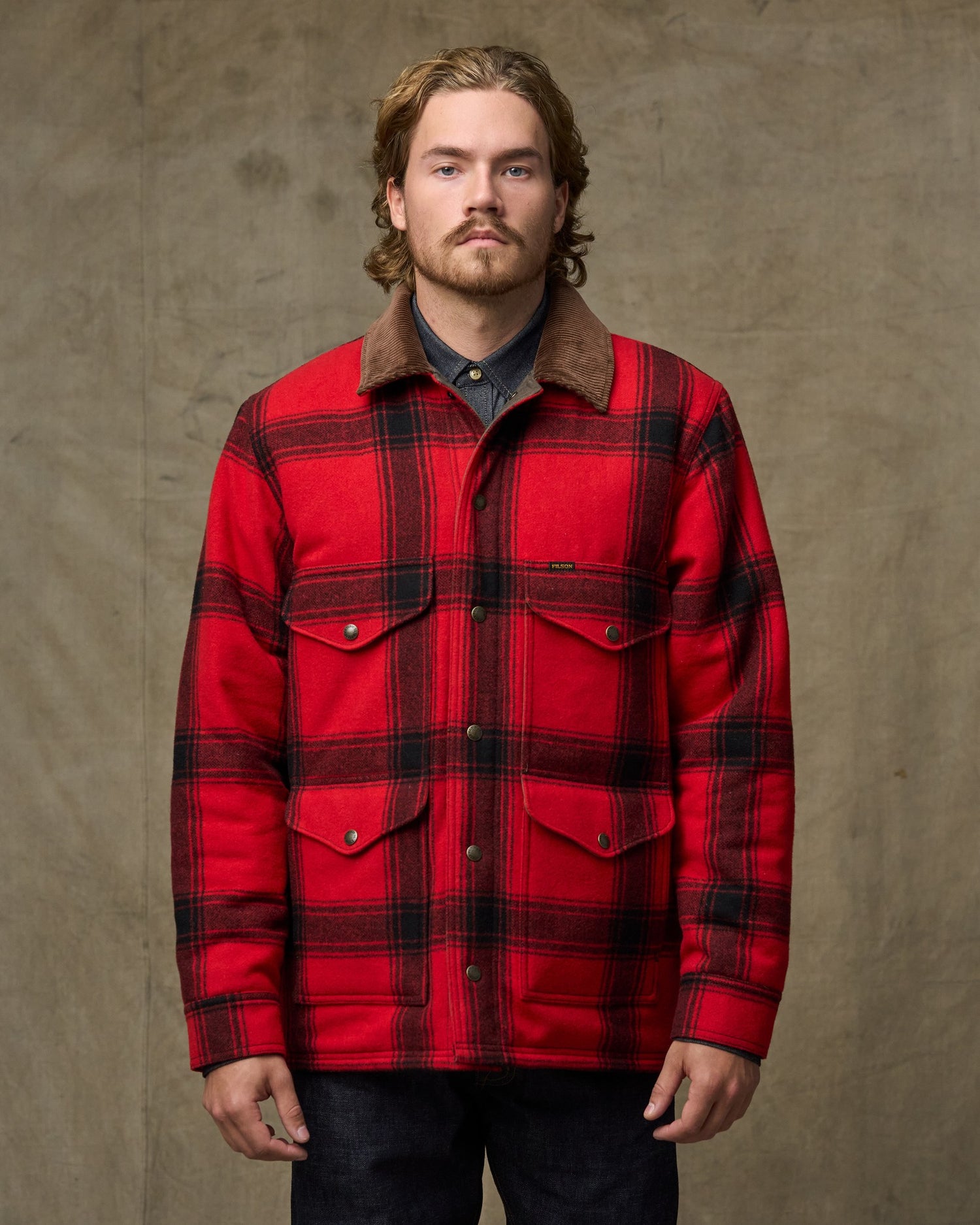 image of a model wearing Filson's Spokane Insulated Cruiser Jacket - Red / Black Windowpane|| Model is 5'11" wearing a size medium