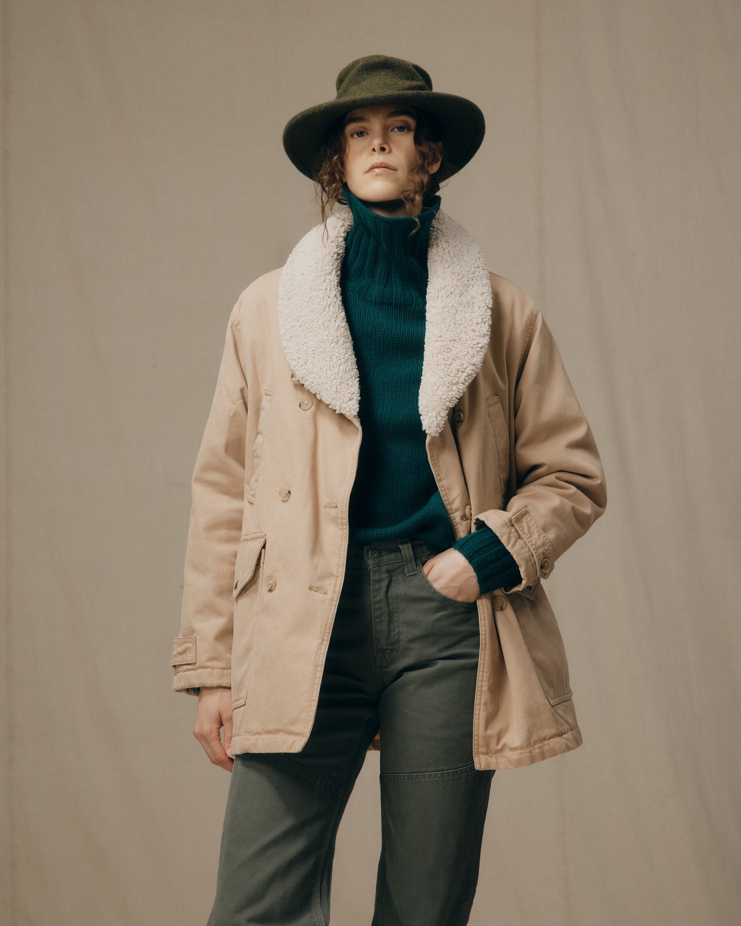image of a model wearing Filson's Women's Canvas Packer Coat - Natural|Model is 5'11" wearing a size medium
