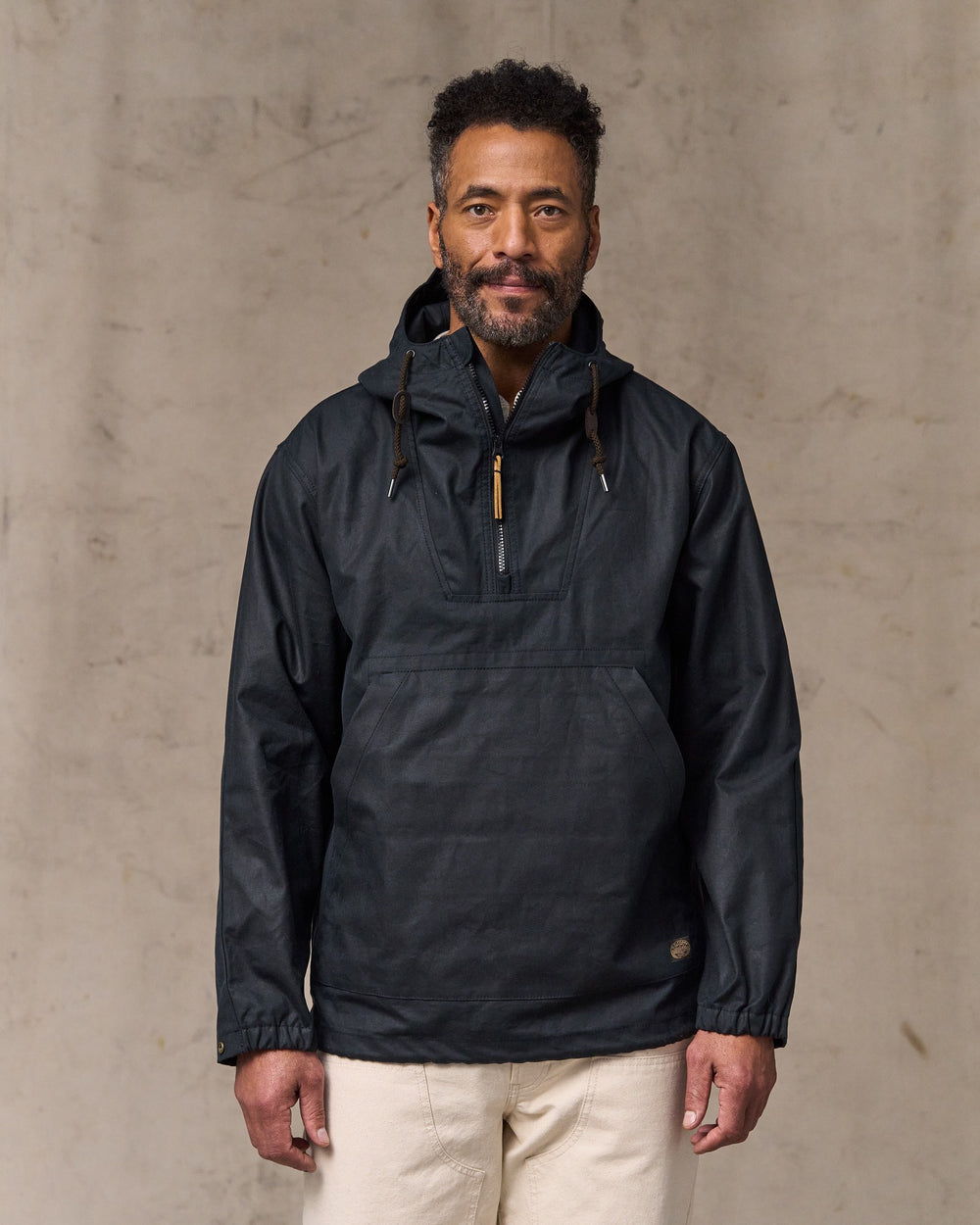 image of a model wearing Filson's Shelter Cloth Waxed Anorak - Harbor Blue