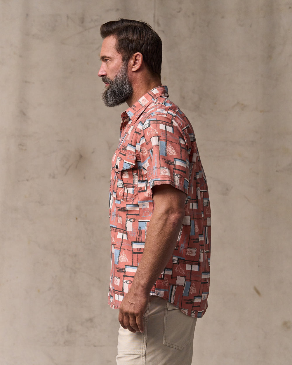 image of a model wearing Filson's Short Sleeve Lightweight Alaskan Guide Shirt  - Russet / Print