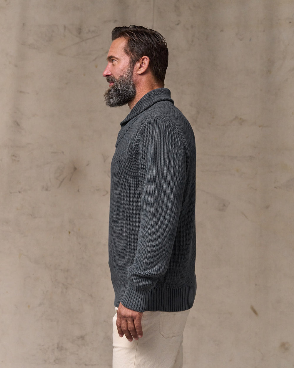 image of a model wearing Filson's Vintage Cotton Shawl Neck Sweater - Charcoal