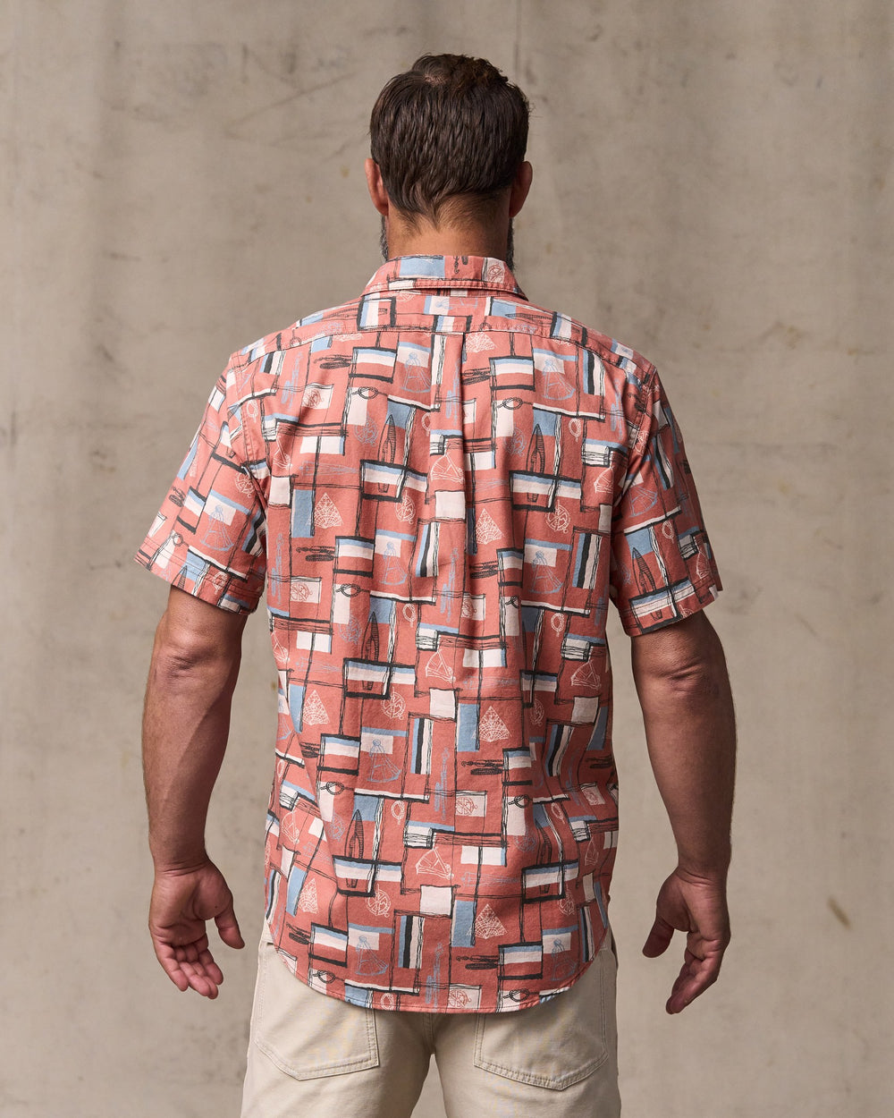 image of a model wearing Filson's Short Sleeve Lightweight Alaskan Guide Shirt  - Russet / Print