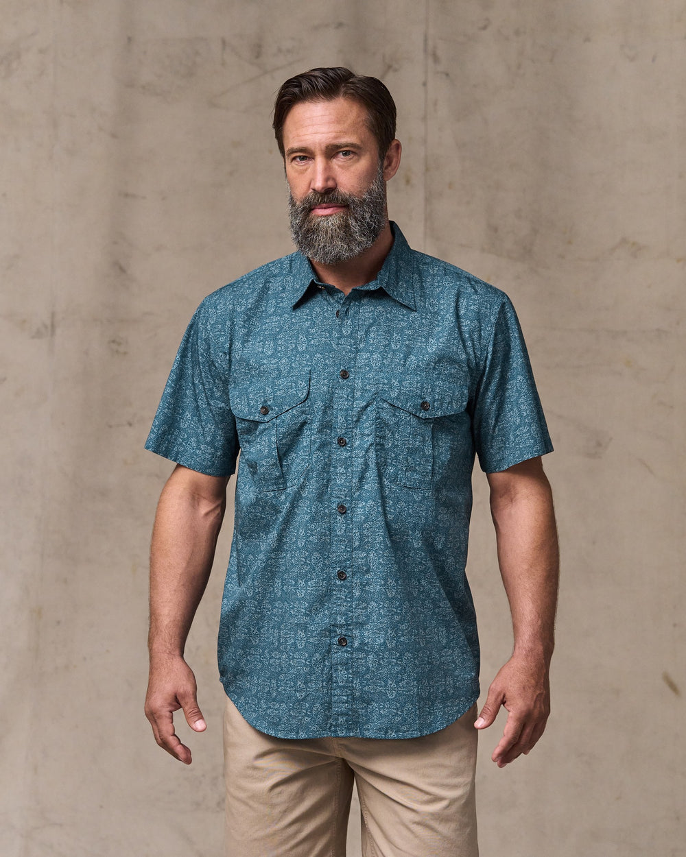 image of a model wearing Filson's Filson's Washed Short Sleeve Feather Cloth Shirt - Blue / Print