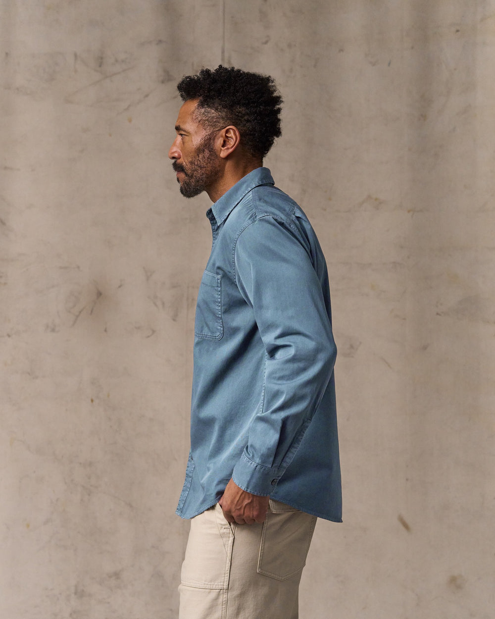 image of a model wearing Filson's 4.5-oz. Twill Shirt - Orion Blue