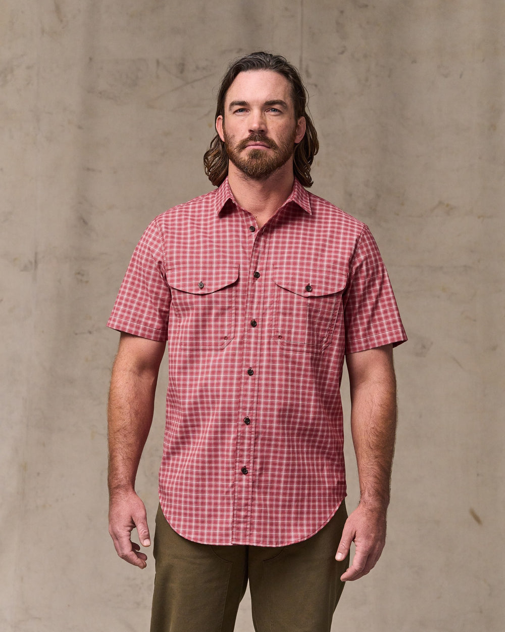 image of a model wearing Filson's Twin Lakes Short Sleeve Sport Shirt - Brick / Cream Plaid