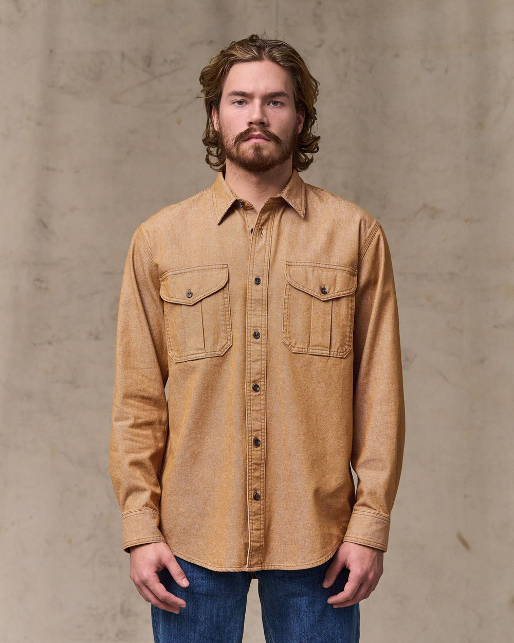 image of a model wearing Filson's Denim Guide Shirt - Harvest Tan