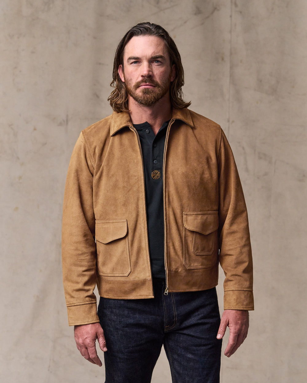 image of a model wearing Filson's Leather Hadlock Jacket - Saddle Brown