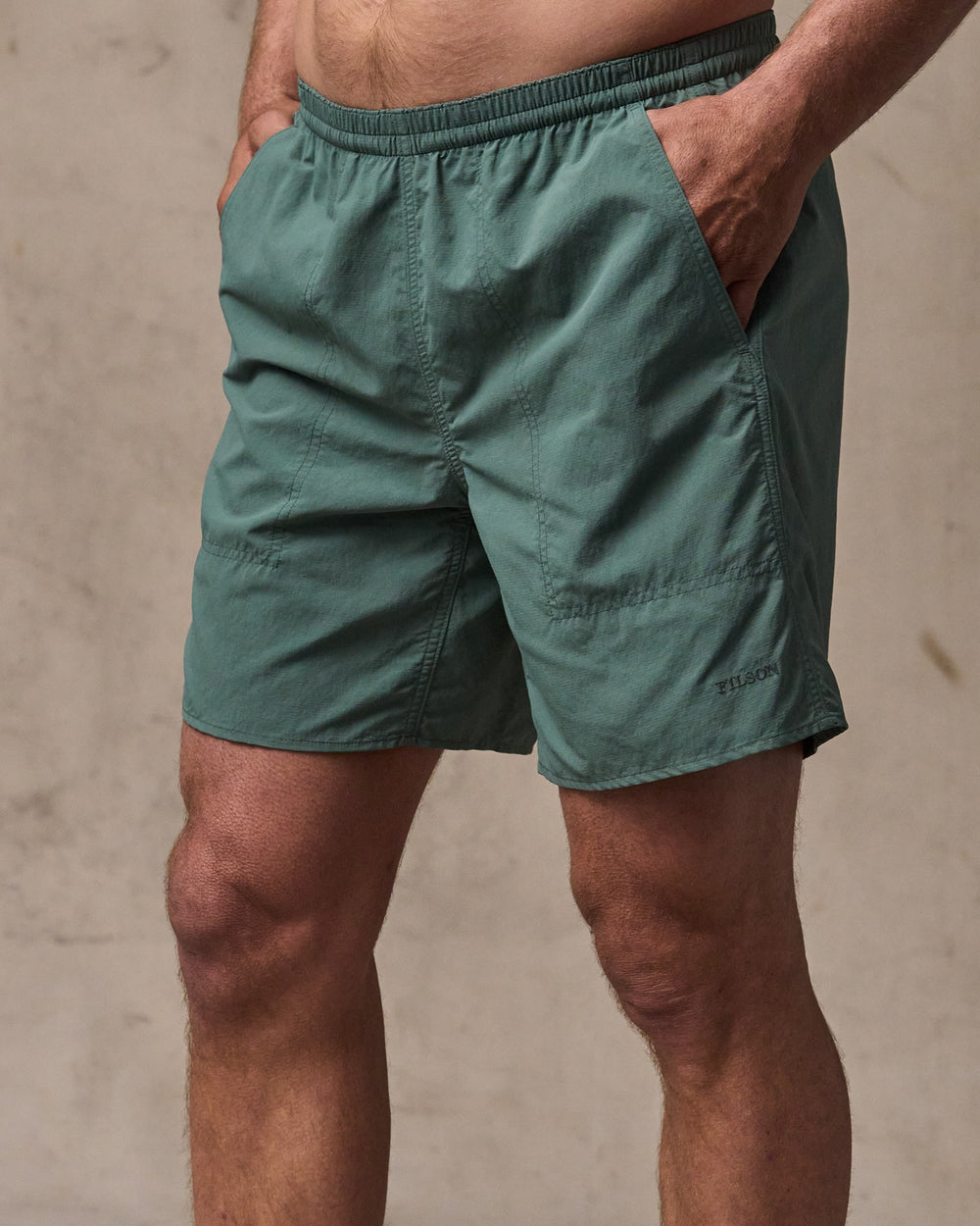 image of a model wearing Filson's Oxbow Lake Trunks - Dark Forest
