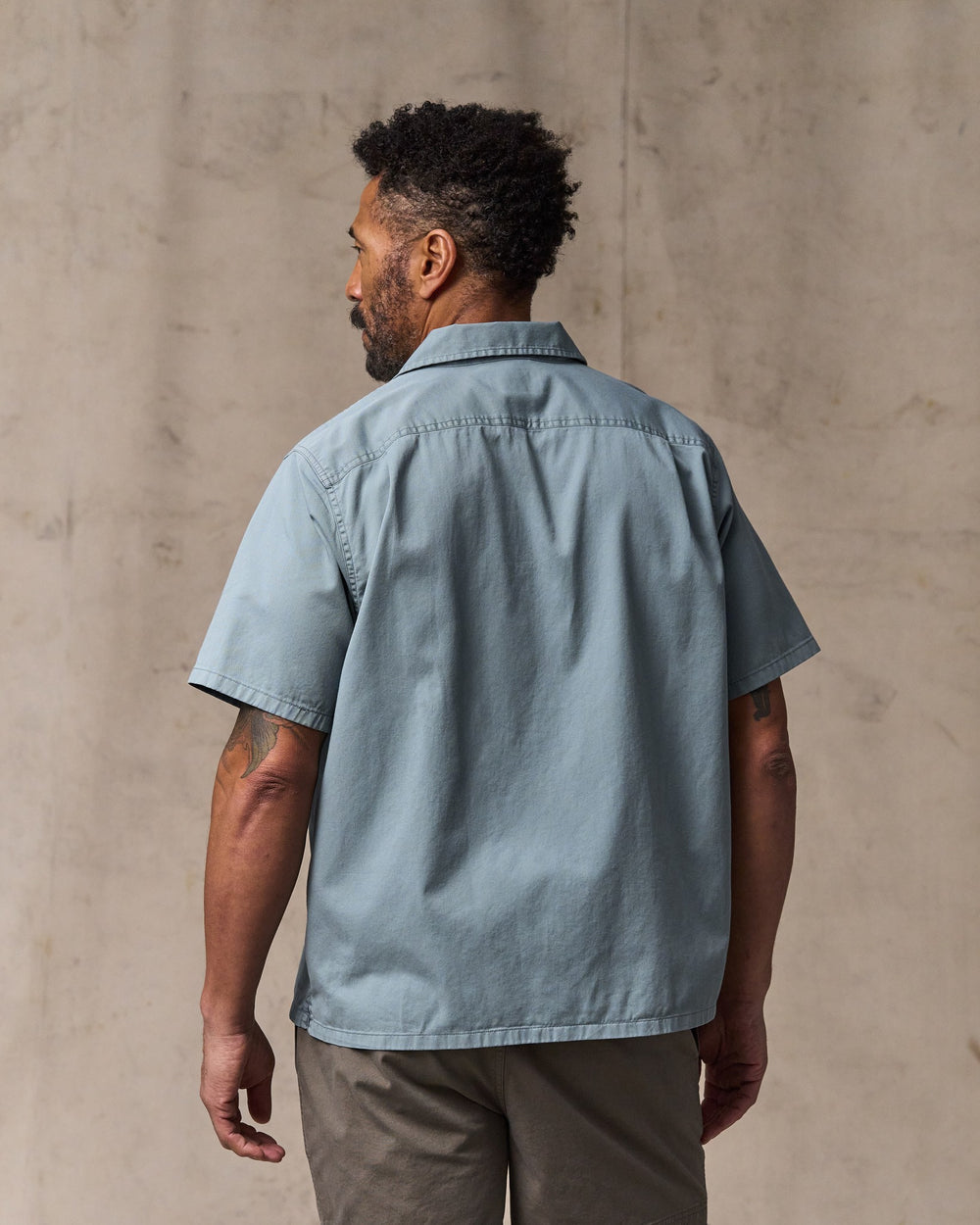 image of a model wearing Filson's Short Sleeve 4.5-oz. Twill Shirt - Lead