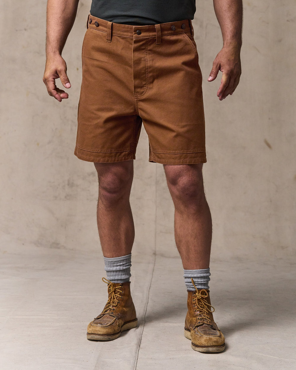 image of a model wearing Filson's Dry Tin Cloth Shorts - Whiskey