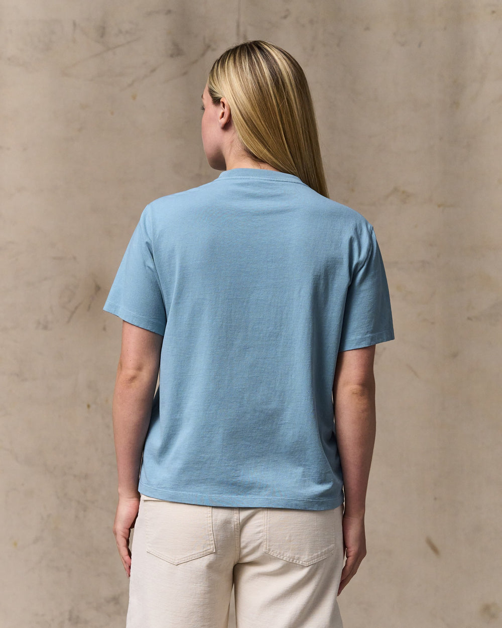 image of a model wearing Filson's Women's Short Sleeve Pocket Tee - Light Blue